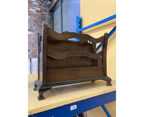 A VINTAGE OAK MAGAZINE RACK 