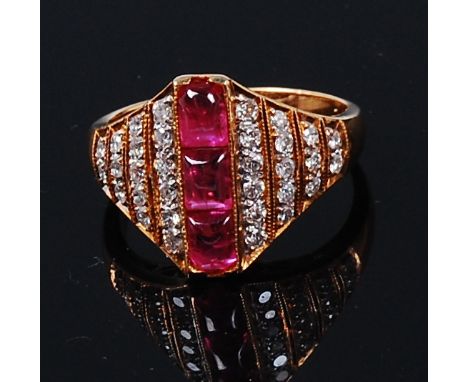 An 18ct gold, ruby and diamond dress ring, arranged as three channel cabochon rubies flanked to either side by four tiers of 