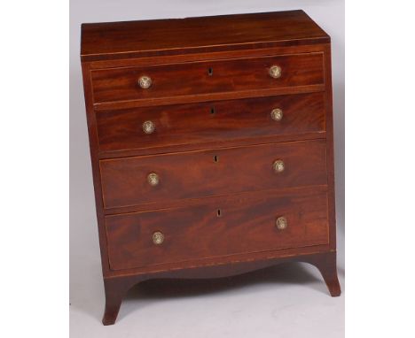 A Regency mahogany chest, of small proportions, having boxwood strung top above four long boxwood strung graduated drawers on