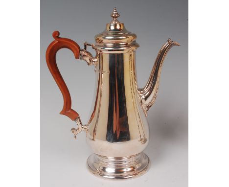 A silver coffee pot, in the Queen Anne style, the pot of baluster form with finial topped and hinged dome cover, flying S scr