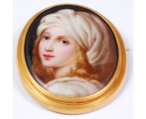 A circa 1900 continental porcelain brooch, possibly Berlin, enamel painted with a portrait of a girl, the whole housed in yel