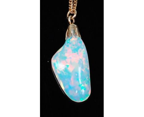 A polished opal pendant, of natural form, weighing approx 10ct and measuring approx 24 x 12 x 7mm, on 14ct gold fine curblink