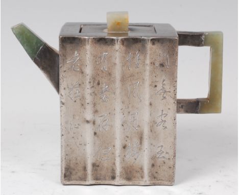 A 19th century Chinese pewter teapot, of fluted square section, having square cut jade finial, handle and spout, the teapot d