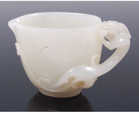 A Chinese carved pale celadon jade dragon cup, the whole with further line carving, h.5.1cm Condition Report / Extra Informat