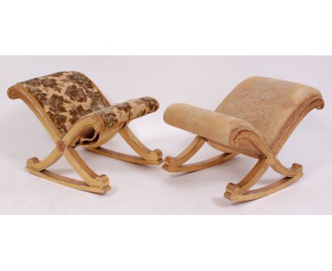 A 19th century giltwood and gesso gout stool, of X shape, with stylised flowerhead moulding and silk worked upholstery (faded