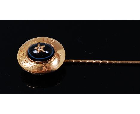 A 19th century yellow metal, black onyx, and diamond set mourning tie-pin, annotated 'In memory of', w.1.4cm, in fitted leath