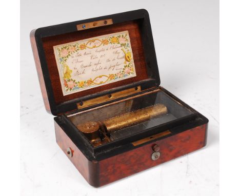 A circa 1900 Swiss birds eye maple cased miniature music box, playing four airs, on a 2¾" cylinder, with original paper label