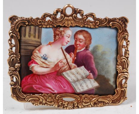 An 18th century polychrome enamel on soft paste porcelain plaque depicting young musicians within a landscape, 5 x 7cm, the w