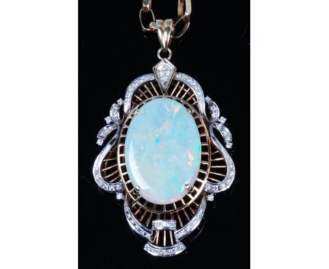A ladies 14ct gold, opal and diamond set pendant, the large four claw set cabochon opal measuring approx 29 x 20 x 5mm, withi