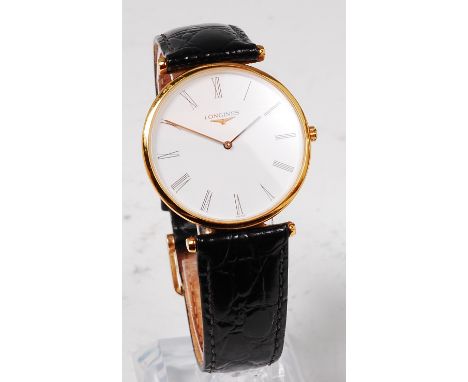 A gents Longines gold cased wristwatch, having signed silvered dial with raised baton markers, subsidiary seconds dial, manua