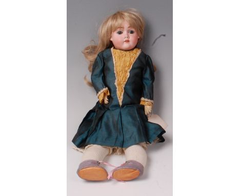 A Max Handwerck doll, further marked to the neck Germany and numbered 0¼, having rolling blue eyes, painted features, composi