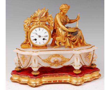 A late 19th century French gilt metal and alabaster mantel clock, mounted with a figure of a seated classical woman on stool,