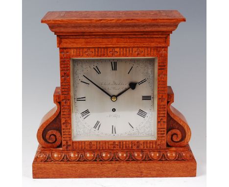 A late 19th century oak cased single fusee mantel clock by Charles Frodsham, the architectural case having scroll sides to eg