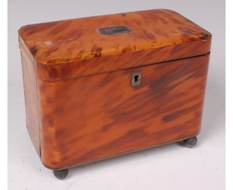A 19th century tortoiseshell inlaid tea caddy, having white metal inlaid plaque and escutcheon, unfitted interior, and on lac