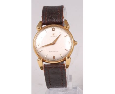 A gents Rolex 18ct gold cased wristwatch, having a signed silvered dial with raised quarter Arabic numerals and baton markers
