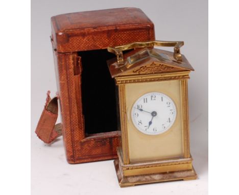 A circa 1900 French lacquered brass carriage clock, having an architectural case, visible platform escapement, white enamel d