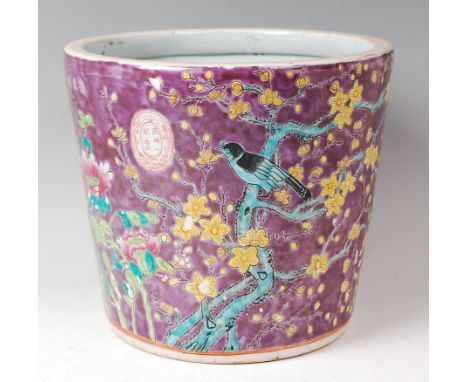 A Chinese enamel decorated stoneware jardiniere, of cylindrical form, decorated with a single bird amidst flowering bamboo, h