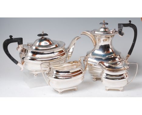 A Walker & Hall silver four piece tea and coffee set, comprising; teapot, coffee pot, twin handled sugar and cream, each of o