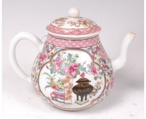 A Chinese famille rose porcelain teapot and cover, enamel decorated with opposing reserves of objects and flowers, all height