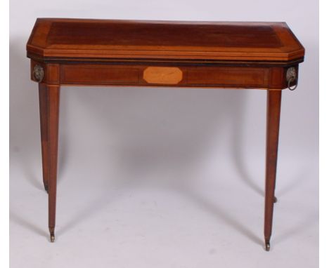 A Regency mahogany and satinwood crossbanded card table, the fold-over top with canted corners, on double rear gatelegs, open