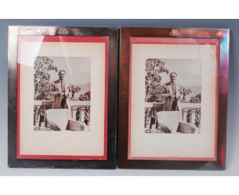 A pair of sterling silver plain photograph frames, (formally with easel backs), each with applied monograms, mahogany backed,