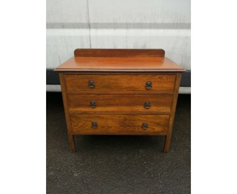 A mid century light oak chest of drawers on block supports. H.85 W.92 D.46cm 