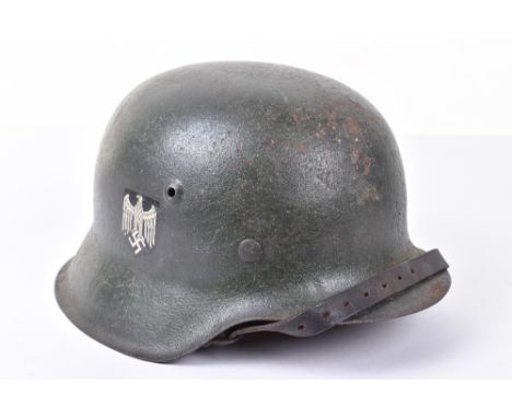 WW2 German Army M-42 Steel Combat Helmet, with rough textured paint finish to the exterior. Complete with its leather liner. 