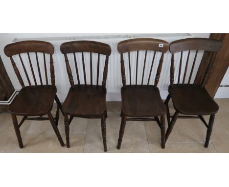 A set of four 19th century elm stick back windsor chairs.