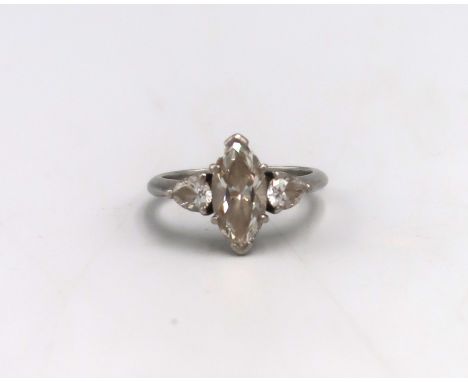 A Tiffany diamond and platinum three stone ring, set with a central marquise cut diamond, 1.41ct, clarity vs2, colour grade w