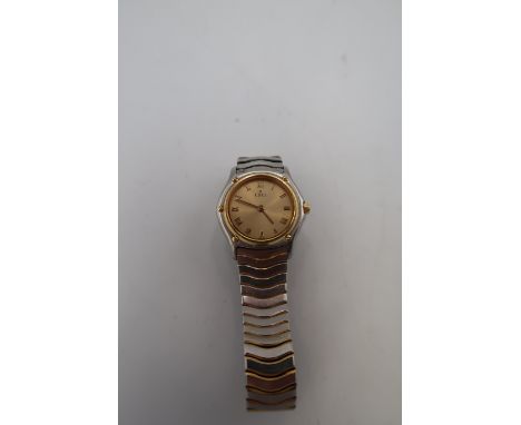 An Ebel wristwatch, the signed champagne dial with Roman numerals, in two tone slim case, numbered 52605943 above E1090121, w