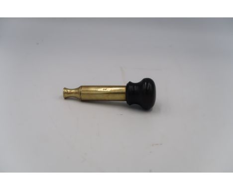 A brass 12 bore decapper calibration tool, 11cm long, by G &amp; J.W Hawksley
