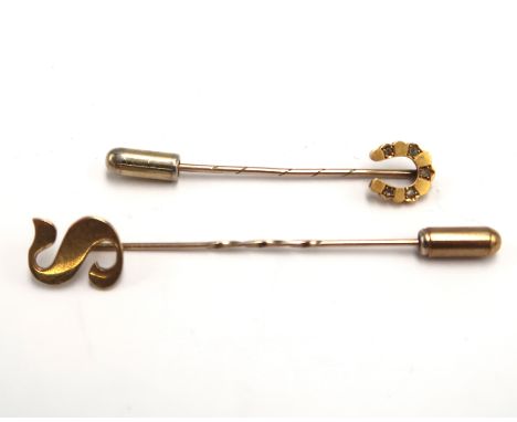 Two gold stick pins one marked 15ct 1.3grams one 9ct 1.8grams.