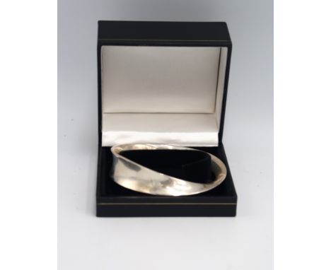 Vivianna Torun Bulow-Hube for Georg Jensen: a Mobius ring silver bangle, number 206, fully signed and numbered, internal widt