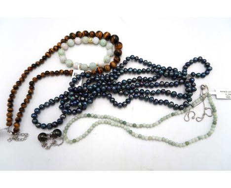 A group of bead and cultured pearl jewellery. To a three row freshwater cultured pearl necklace, a pair of cultured pearl ear