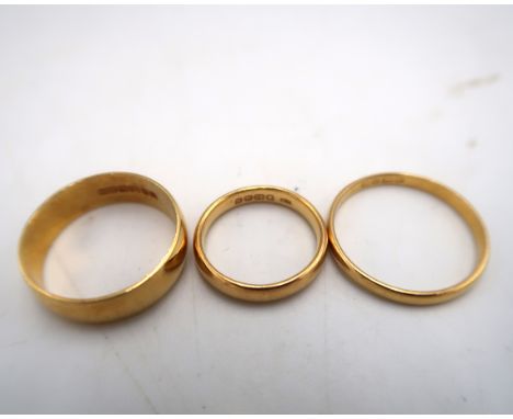 Three hallmarked 22ct yellow gold wedding bands sizes Q/R, T &amp; H - total eight approx 12.3 grams