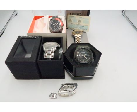 An Emporio Armani stainless steel gents wristwatch and a Fossil Hybrid smartwatch, a G Shock gents wristwatch, a Seiko Kineti