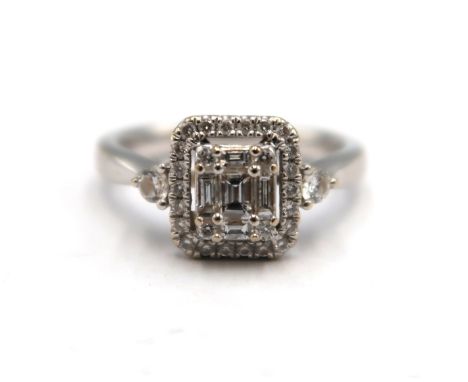 An 18ct white gold baguette and brilliant cut diamond cluster ring - stated total diamond weight 0.42ct - clarity SI1, colour