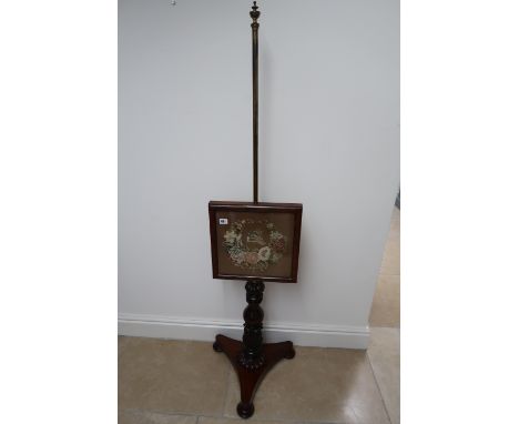 A mahogany veneered Victorian pole-screen with tapestry panel.