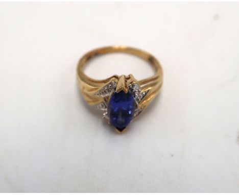 A 9ct gold marquise tanzanite and diamond dress ring. Size K. Weight 2.40 grams