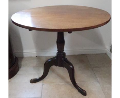 A 19th century mahogany tripod table with 83cm diameter top - one leg with old repairs