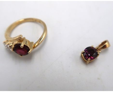 A 9ct gold spinel and zircon crossover ring. Size K. Together with a 9ct spinel single stone pendant. Weight 3.56 grams