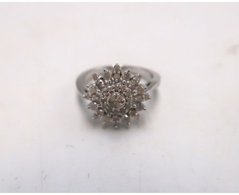 A 9ct gold diamond snowflake cluster ring. Weight 0.50ct. Size K. Weight 2.76 grams.
