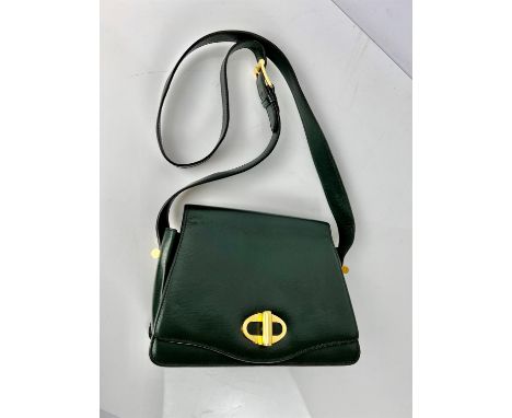 A quality dark green leather vintage DUNHILL structured handbag with long strap, cosmetic mirror and gold coloured hardware. 