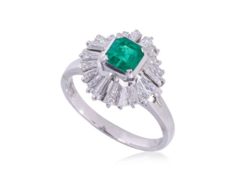 AN EMERALD AND DIAMOND RING
Featuring an emerald cut emerald weighing approximately 0.73 Cts (marked), mounted in a platinum 