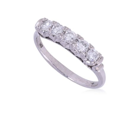 A FIVE STONE DIAMOND PLATINUM RING
Featuring round brilliant cut diamonds totalling approximately 0.40 Cts, mounted in a plat