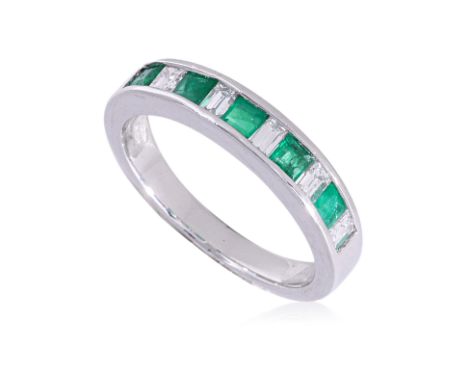 A CHANNEL SET EMERALD AND DIAMOND RING
Featuring square cut emeralds weighing approximately 0.40 Cts, mounted in a white gold