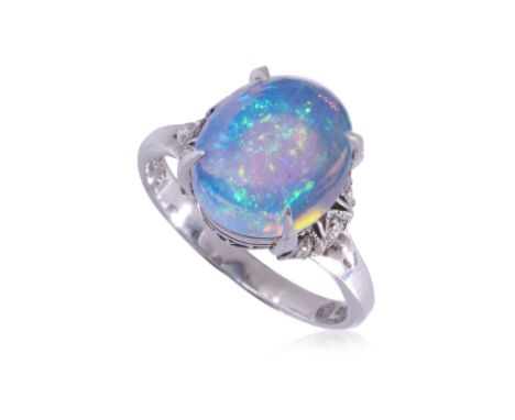 AN OPAL AND DIAMOND RING
Featuring an opal weighing approximately 3.31 Cts (marked), mounted in a platinum setting marked 'PM