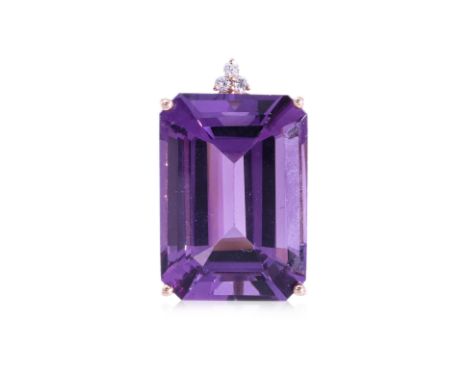 AN AMETHYST AND DIAMOND PENDANT
Featuring an emerald cut amethyst weighing approximately 13.0 Cts (marked), mounted in a rose