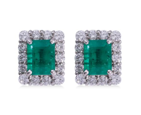 A PAIR OF EMERALD AND DIAMOND 'HALO' STUD EARRINGS Featuring a pair of emerald cut emeralds totalling approximately 0.52 Cts 