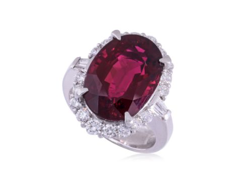 A 'RUBELLITE' TOURMALINE AND DIAMOND RING Featuring an oval shaped rubellite tourmaline weighing approximately 8.588 Cts (mar